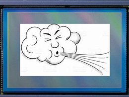 Close-up shot of a camera sensor, with a picture of a cartoon cloud blowing that has been edited in the centre of the screen